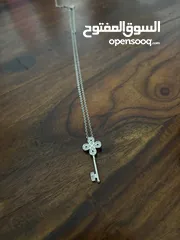  1 Swarovski key necklace - worn once. In very good condition.