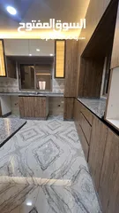  12 شقه طابقيه اربع غرف نوم الزرقاءالجديده شارع الونك  خلف فندق الجوابره مع مطبخ للبيع