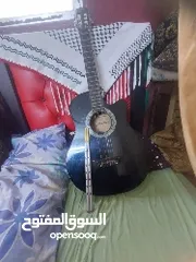  1 جيتار مع شنته ومجوز مع ابنيات