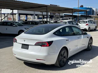  4 Tesla model 3 2023 لون آبيض لؤلؤي