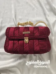  6 تألقي مع حقيبة اليد الخمرية الفاخرة - تصميم يدوي يروي حكاية أنوثة واناقة