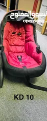  6 Junior brand stroller and car seat.