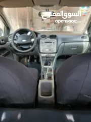  5 فورد فوكس 2009  ايد اولى سيارة  جير عادي اقصادية بل بنزين