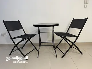  1 Black table with glass on top + 2 chairs