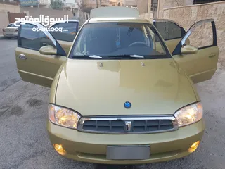  9 كيا سبكتر توماتيك اقساط دفعة 1200 دهان جديد  ماتور جديد  قير جيد  فحص مرفق  مكانيك سيارة مشية ناعمة