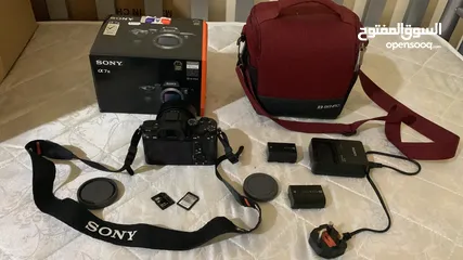  5 sony A73 camera body +50mm1.8 + charger + 2battery + 2 sd cards + red clr bag