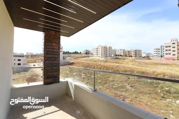  23 شقة مع روف مميز باجمل مناطق عمان بتشطيبات مميزة واطلالة رائعه مساحة 207م