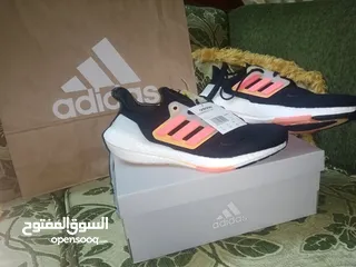  6 حذاء adidas UltraBoost 22 Black Flash Orange اصلي بنص سعره بسعر مغري جدا الفضل للمشي والراحة