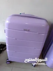  3 purple suitcase used once