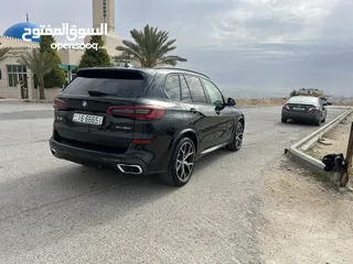  5 بي ام دبليو X5 لون اسود موديل 2022 Mكيت فل كامل فحص كامل وارد وكاله عمان
