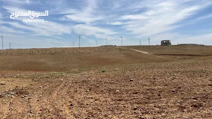  13 للاستثمار : ارض للبيع 1128 متر - جامعة العلوم والتكنولوجيا - مرتفعة مطلة وصخرية بسعر مغري