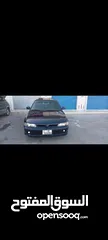  5 متسوبيشي لانسر موديل 1994 لون كحلي ترخيص طويل