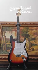  6 Fender electric guitar stratocaster replica with 10 watt amplifier.