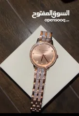  1 Michael Kors rose gold watch for women.