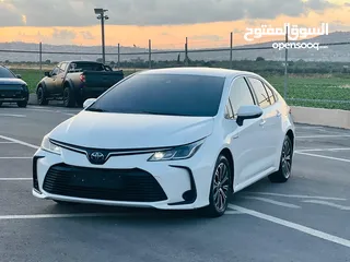  4 تيوتا كورولا هايبرد ترخيص 2022 فل بدون فتحة مميزة  ماتور 1800cc ( بنزين + كهرباء) 170Hp