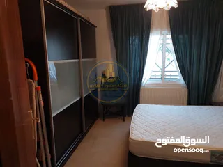  5 رقم الاعلان (5315) شقة أرضية للبيع في الرابية مقابل شيف اياد موقع مميز