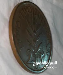  3 عملة فلسطينية تاريخية نادرة من فئة 2 مل صادرة عام 1927 خلال فترة الانتداب البريطاني على فلسطين.