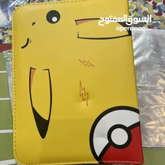  4 كروت بوكيمون والبومات (Pokemon cards and binders)