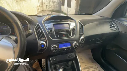  19 2009 ‏Hyundai توسان LX20 اربع ابواب، اللون فيراني، الكراسي جلد والسيارة 92,000 كيلو فقط وبحالة رائعة