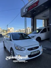  1 هونداي اكسنت 2015 محرك 1600 ديزل لون ابيض فرش جلد تشغيل بصمه حساسات خلفيه كاميرا خلفيه ترخيص وتامين