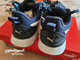  2 Puma shoes