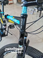  9 دراجة هوائية من نوع SPORTS INC من طراز SHIMANO جنط 26 باللون الأزرق اقرأ الوصف بدقة قابل للتفاوض