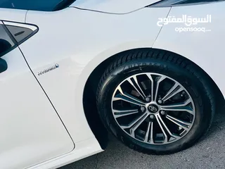  11 تيوتا كورولا هايبرد ترخيص 2022 فل بدون فتحة مميزة  ماتور 1800cc ( بنزين + كهرباء) 170Hp