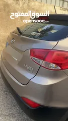  9 2009 ‏Hyundai توسان LX20 اربع ابواب، اللون فيراني، الكراسي جلد والسيارة 92,000 كيلو فقط وبحالة رائعة