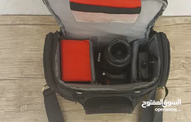  5 كاميرا نيكون دي 3100 مع عدسة اضافية وكامل أغراضها Nikon D3100