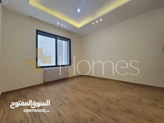  9 شقة ارضية مع ترس للبيع في رجم عميش بمساحة بناء 215م