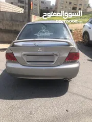  1 لانسر 2004 جير عادي الفحص موجود بالصور