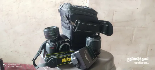  4 كاميرا نيكون 3100/D التفاوض بسعر قليل