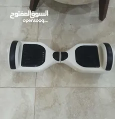  1 Hoverboard مع شاحن موجود شبه جديد