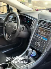  4 فورد فيوجن 2014 هايبرد تيتانيوم فل اضافات ماشيه 70 الف فقط بحاله الشركة
