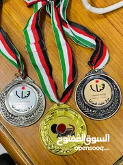  1 ميداليات دروع وكروت وكتب هاردكفر مطوية ودفاتر سندات