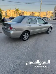  10 ميتسوبيشي لانسر فحص كامل 1600اصلي ولا ملاحظه موديل 2009 اوتوماتيك بوضع الشركه وارد الكويت مالك واحد