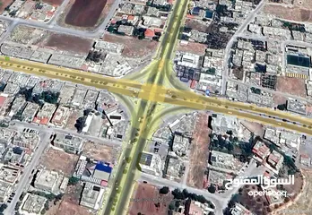  1 ارض تجاري للبيع - اربد - شارع بغداد الرئيسي - قرب اشارة صالة بردى
