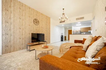  16 دبي لاند SKYCOURT  غرفة وصالة  مفروشة  سوبرلوكس مع بلكونه-إيجار شهري شامل