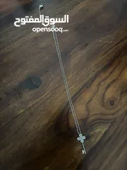  2 Swarovski key necklace - worn once. In very good condition.