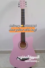  1 New acoustic guitar, with bag and picks, delivery