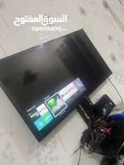  2 Samsung smart tv 42 inches + cabinet