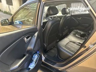 14 2009 ‏Hyundai توسان LX20 اربع ابواب، اللون فيراني، الكراسي جلد والسيارة 92,000 كيلو فقط وبحالة رائعة