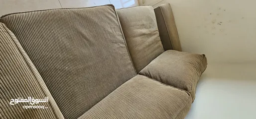  2 brown  corduroy sofa and green fabric sofa