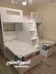  28 تخت طابقين ثلاثي مكفول 5 سنوات بحمل 150 كيلو  الخشب لامنيت مسمك ع خمالتين 3.5 سم