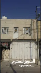  13 بيت مع بنايه طابقين على شارع تجاري الموفقية الاملاك قرب محلات محمد البغدادي