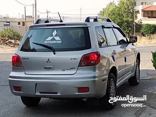  5 ميتسوبيشي آوتلاندر اوتوماتيك 2003 توب نظافة بسعرررر مميززز محرك 2400cc
