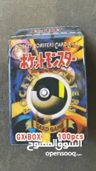  2 كروت بوكيمون والبومات (Pokemon cards and binders)