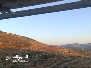  1 أرض مفروزة مطلة  منطقة A في عنبتا جبل الشيخ عيسى إطلالة غربية تقع على شارعين