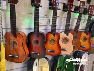  4 جيتار طفل خشب