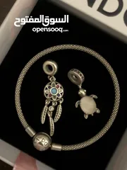  2 PANDORA bracelet, for sale, plus two charms as a gift. price for all 60 dinars